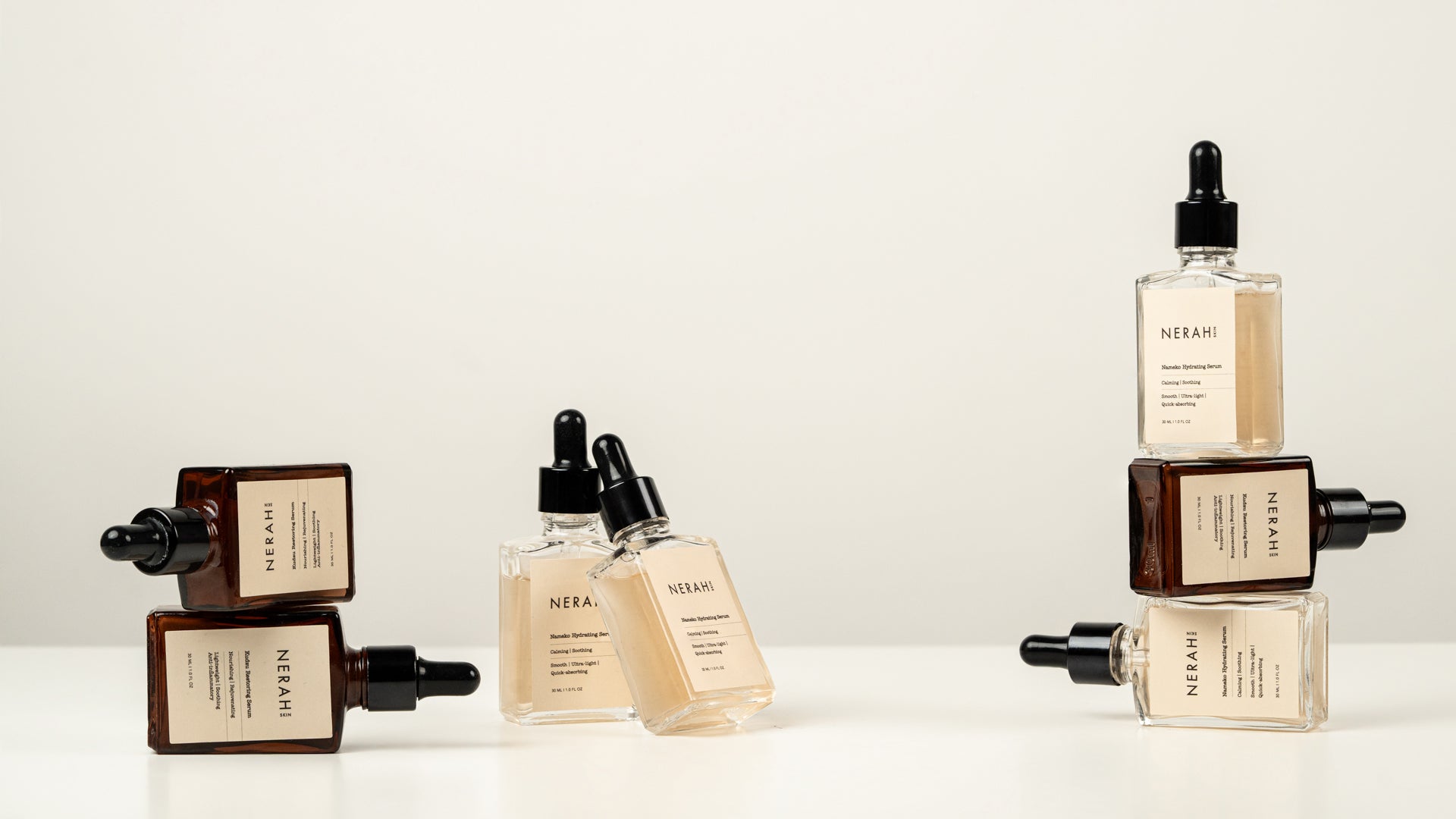Kudzu Restoring Serum and Nameko Hydrating Serum bottles elegantly placed, highlighting their clean and minimal design.