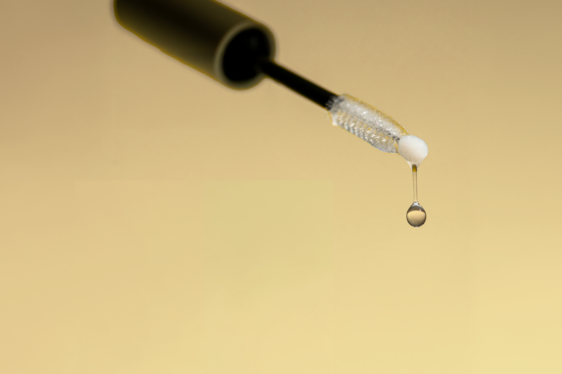 Droplet of Ginseng Lash & Brow Serum, showcasing its water-based, lightweight formula for effortless absorption and healthy, nourished lashes and brows.